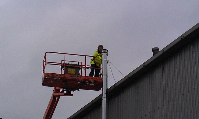 Replacing a boiler flue on an aircraft hanger